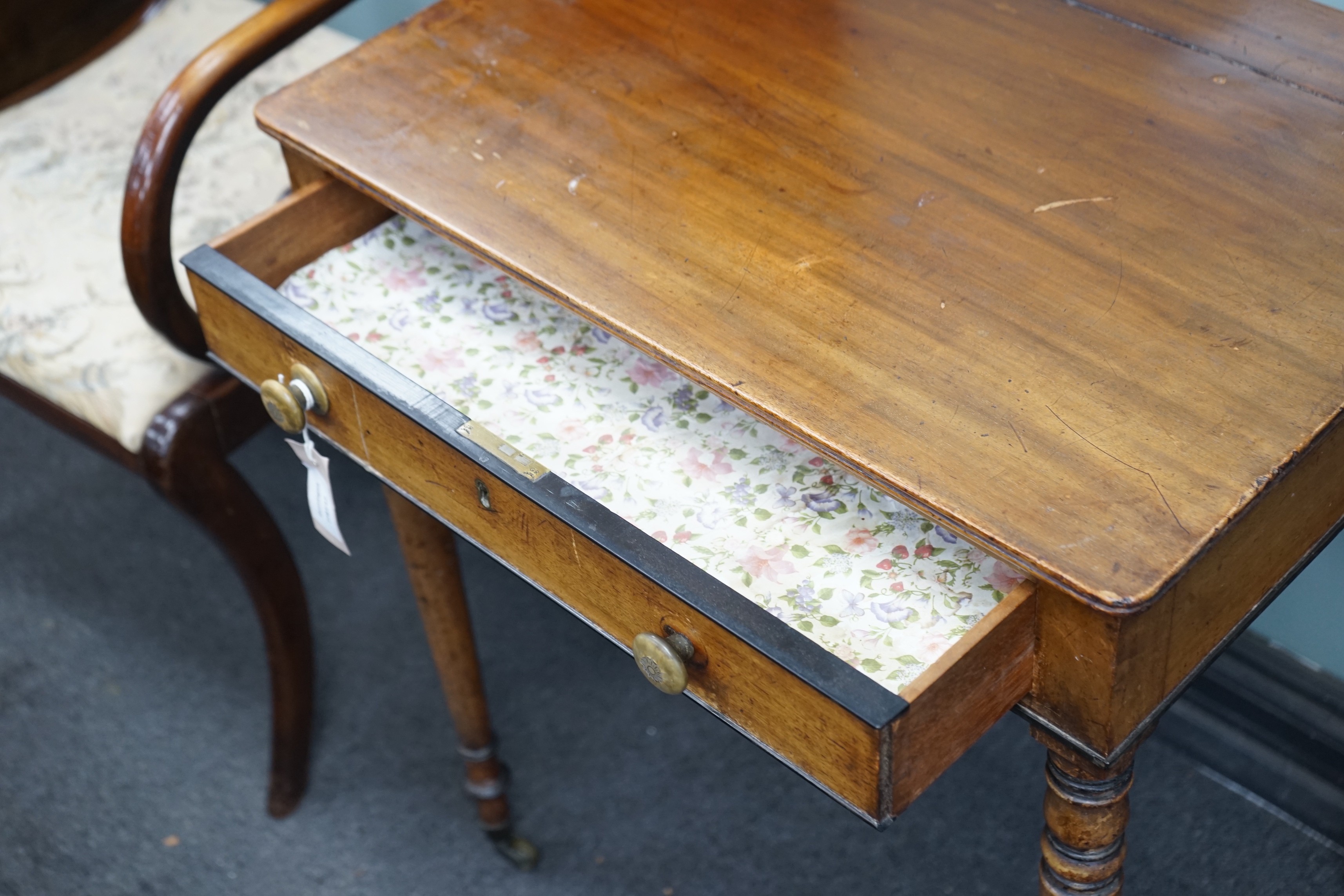 A George IV mahogany writing table with frieze drawer on turned legs, width 61cm, depth 45cm, height 73cm